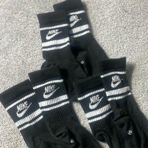 3 pairs of NIke black comfort socks.  High socks. Worn once or twice.